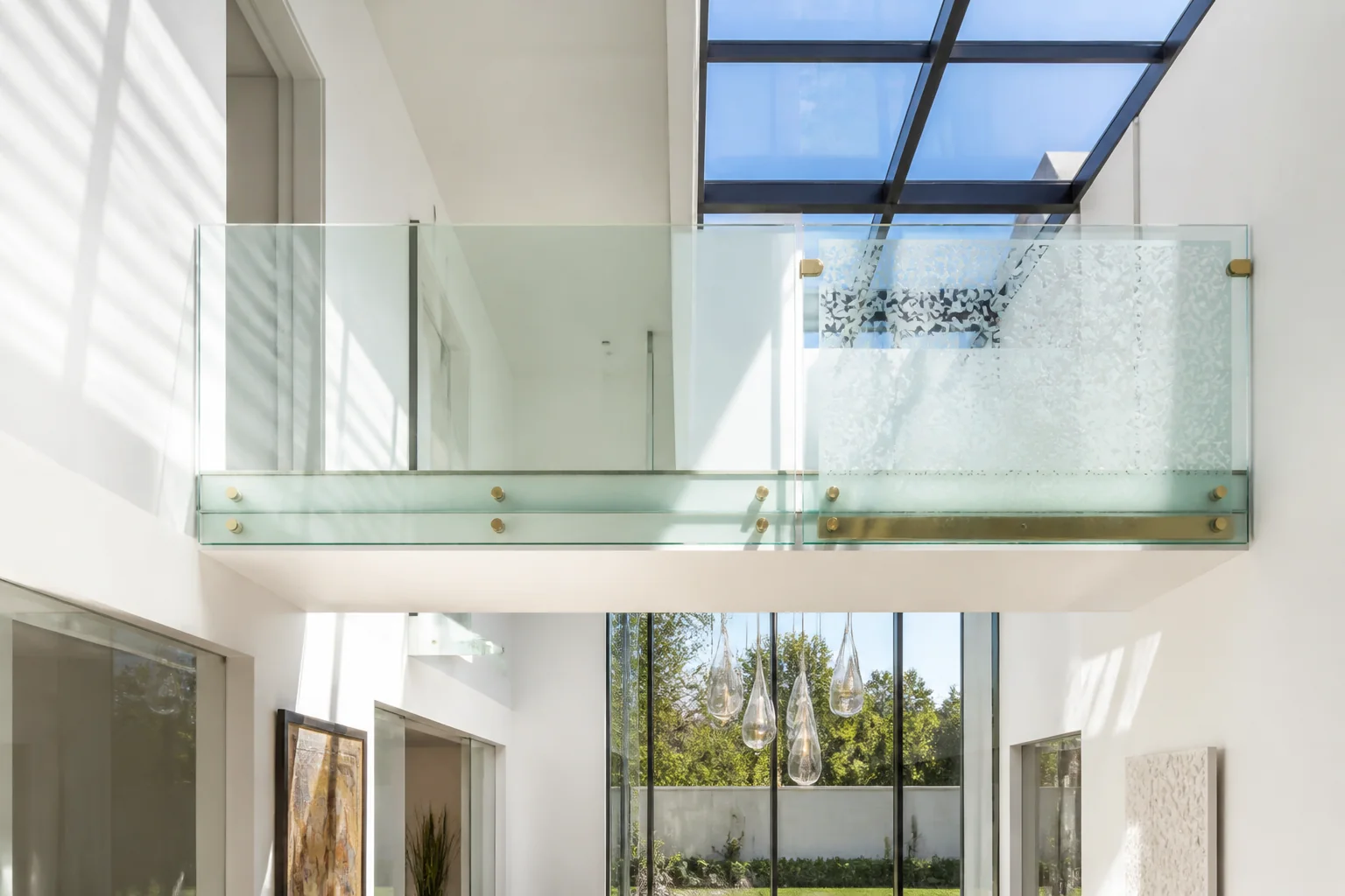 Architectural interior glass bridge and mezzanine balustrade with ultra-clear low-iron laminated safety glass